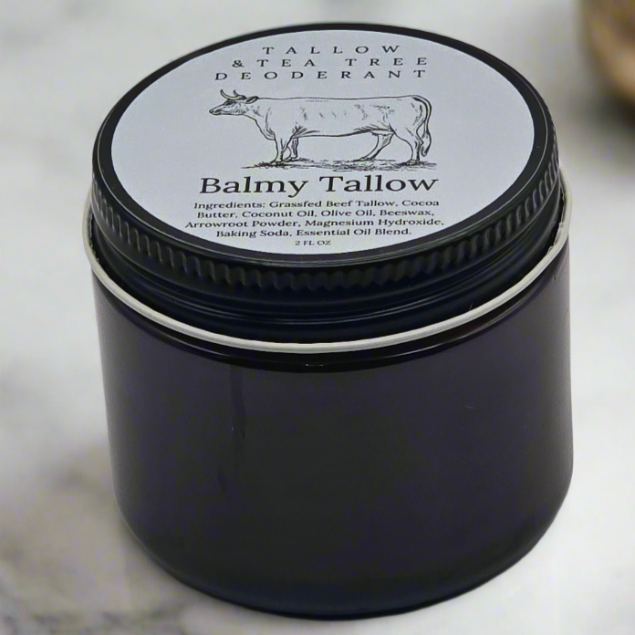 Tallow & Tea Tree Deodorant sitting on a white marble countertop 